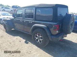 2021 Jeep Wrangler Unlimited Rubicon with VIN 1C4HJXFN5MW509483, listed as a IAAI auction lot 42245703 with 59,461 mi miles and . Bid and sale history available at DreamBid. Image 3.