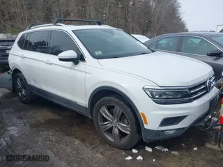 2019 Volkswagen Tiguan SEL Premium with VIN 3VV4B7AX7KM123859, listed as a IAAI auction lot 41555664 with 77,384 mi miles. Bid and sale history available at carsss.com. Image 1.