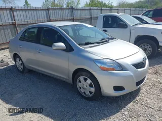 2009 Toyota Yaris with VIN JTDBT903X91301963, listed as a IAAI auction lot 42102283 with 143,966 mi miles. Bid and sale history available at carsss.com. Image 1.