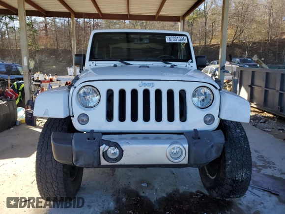 2014 Jeep Wrangler Sahara with VIN 1C4AJWBG1EL168007, listed as a Copart auction lot 87331394 with 113,228 mi miles and Salvage Title. Bid and sale history available at DreamBid. Image 5.