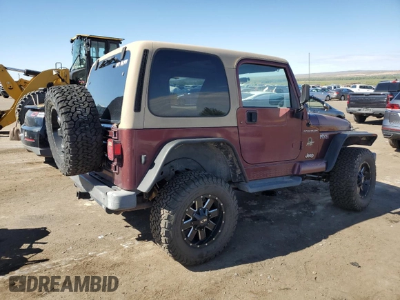 2002 Jeep Wrangler Sahara with VIN 1J4FA59S12P704608, listed as a Copart auction lot 69146504 with 125,920 mi miles and Salvage Title. Bid and sale history available at carsss.com. Image 3.