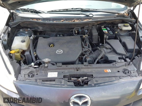 2012 Mazda 5 Sport with VIN JM1CW2BL8C0131745, listed as a IAAI auction lot 42625411 with 194,875 mi miles and . Bid and sale history available at DreamBid. Image 10.