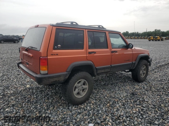 1999 Jeep Cherokee Sport with VIN 1J4FF68S7XL560943, listed as a Copart auction lot 58425505 with 68,654 mi miles and Salvage title. Bid and sale history available at DreamBid. Image 3.