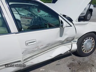 1999 Cadillac DeVille z VIN 1G6KD54Y3XU712969, wystawiony jako IAAI lot #42344041 z przebiegiem 169 572 mil mil oraz . Historia ofert i sprzedaży dostępna na DreamBid. Obrazek 12.