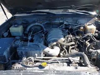 2003 Lexus LX with VIN JTJHT00W233532297, listed as a IAAI auction lot 42189676 with 235,992 mi miles. Bid and sale history available at carsss.com. Image 10.