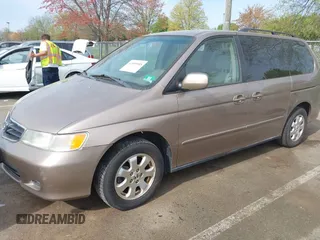 2003 Honda Odyssey EX with VIN 5FNRL186X3B031520, listed as a IAAI auction lot 42095955 with 142,566 mi miles and . Bid and sale history available at DreamBid. Image 2.