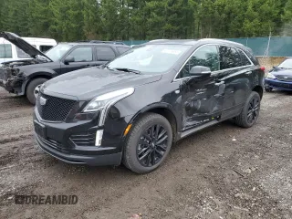 2021 Cadillac XT5 AWD Luxury z VIN 1GYKNBR47MZ221053, wystawiony jako Copart lot #40775654 z przebiegiem 13 784 mil mil oraz . Historia ofert i sprzedaży dostępna na DreamBid. Obrazek 1.