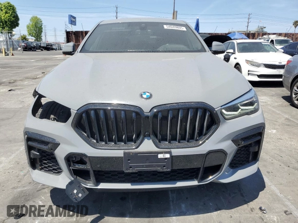 2022 BMW X6 xDrive40i z VIN 5UXCY6C01N9M95573, wystawiony jako Copart lot #54049805 z przebiegiem 24 031 mil mil oraz Szkoda całkowita • Salvage title. Historia ofert i sprzedaży dostępna na DreamBid. Obrazek 5.