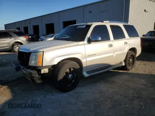 2002 Cadillac Escalade z VIN 1GYEC63T52R325046, wystawiony jako Copart lot #45301545 z przebiegiem 273 143 mil mil oraz Szkody całkowita. Historia ofert i sprzedaży dostępna na DreamBid. Obrazek 1.