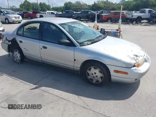 2002 Saturn SL z VIN 1G8ZH52882Z132545, wystawiony jako IAAI lot #42001781 z przebiegiem 243 270 mil mil oraz . Historia ofert i sprzedaży dostępna na DreamBid. Obrazek 1.