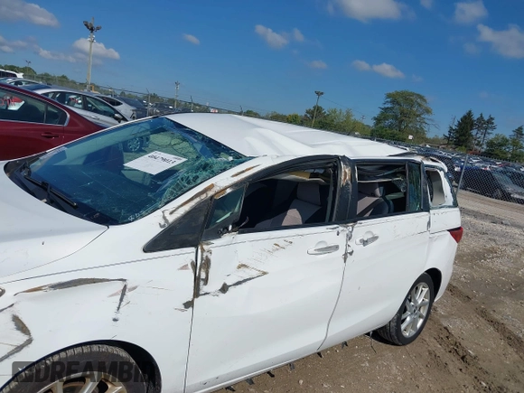 2013 Mazda 5 Touring with VIN JM1CW2CLXD0151396, listed as a IAAI auction lot 40479013 with 118,314 mi miles and . Bid and sale history available at DreamBid. Image 6.