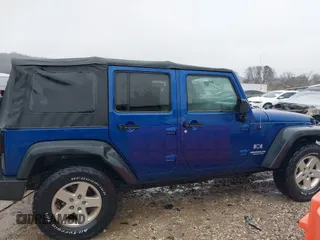 2009 Jeep Wrangler Unlimited X with VIN 1J4GA39189L787777, listed as a IAAI auction lot 41570579 with 193,163 mi miles. Bid and sale history available at carsss.com. Image 13.