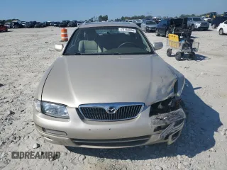 1999 Mazda Millenia z VIN JM1TA2217X1502746, wystawiony jako Copart lot #72165894 z przebiegiem 196 957 mil mil oraz Szkody całkowita. Historia ofert i sprzedaży dostępna na DreamBid. Obrazek 5.