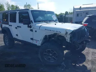 2014 Jeep Wrangler Unlimited Rubicon X with VIN 1C4BJWFG6EL240849, listed as a IAAI auction lot 42216082 with 118,912 mi miles and . Bid and sale history available at DreamBid. Image 1.