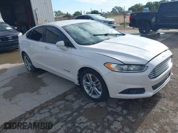 2016 Ford Fusion SE Hybrid z VIN 3FA6P0LU2GR202472, wystawiony jako IAAI lot #42637403 z przebiegiem Nie podano mil oraz . Historia ofert i sprzedaży dostępna na DreamBid. Obrazek 1.