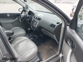 2006 Ford Focus S with VIN 1FAFP37N26W180795, listed as a IAAI auction lot 42100395 with 125,002 mi miles. Bid and sale history available at carsss.com. Image 5.