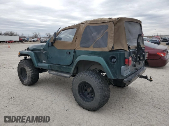 2000 Jeep Wrangler Sahara z VIN 1J4FA59S5YP803327, wystawiony jako Copart lot #44382505 z przebiegiem Nie podano mil oraz Szkoda całkowita • Salvage title. Historia ofert i sprzedaży dostępna na DreamBid. Obrazek 2.