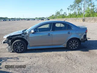 2015 Mitsubishi Lancer SE with VIN JA32V2FWXFU023626, listed as a IAAI auction lot 42012381 with 143,981 mi miles. Bid and sale history available at carsss.com. Image 14.