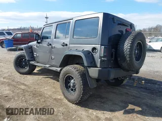 2014 Jeep Wrangler Unlimited Sport with VIN 1C4HJWDG1EL251271, listed as a IAAI auction lot 41647210 with 100,168 mi miles. Bid and sale history available at carsss.com. Image 3.