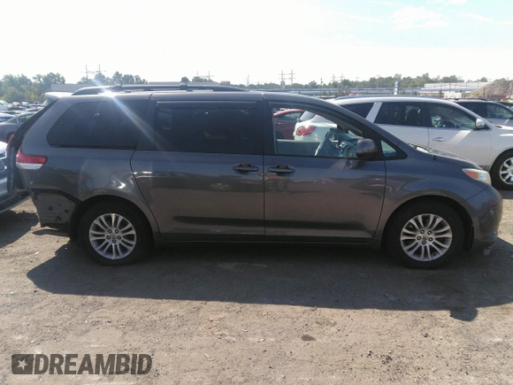 2014 Toyota Sienna XLE with VIN 5TDYK3DC2ES418860, listed as a IAAI auction lot 40139260 with 67,599 mi miles and . Bid and sale history available at DreamBid. Image 14.