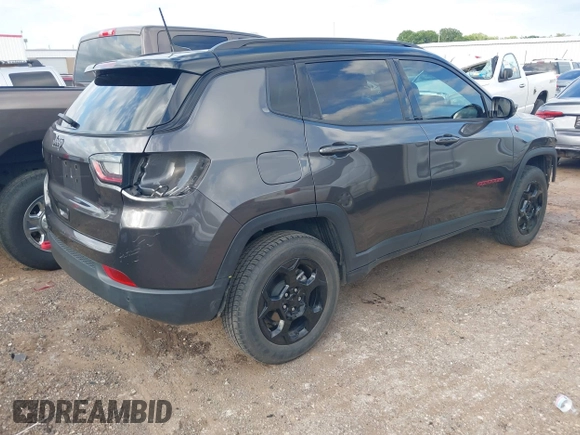 2023 Jeep Compass Trailhawk with VIN 3C4NJDDNXPT536872, listed as a IAAI auction lot 42437282 with 28,293 mi miles and . Bid and sale history available at DreamBid. Image 4.