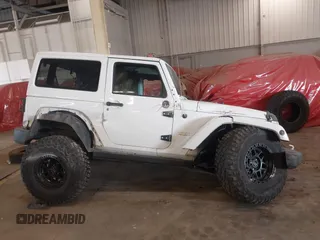 2012 Jeep Wrangler Arctic z VIN 1C4AJWBG9CL233232, wystawiony jako IAAI lot #42282805 z przebiegiem 109 927 mil mil oraz . Historia ofert i sprzedaży dostępna na DreamBid. Obrazek 13.