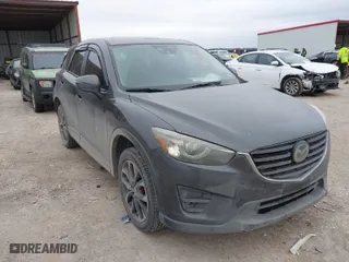 2016 Mazda CX-5 Grand Touring with VIN JM3KE2DY5G0651633, listed as a IAAI auction lot 41588338 with 107,075 mi miles. Bid and sale history available at carsss.com. Image 1.