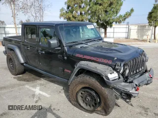 2020 Jeep Gladiator Rubicon z VIN 1C6JJTBG7LL197837, wystawiony jako Copart lot #58169095 z przebiegiem 59 578 mil mil oraz Szkoda całkowita • Salvage title. Historia ofert i sprzedaży dostępna na DreamBid. Obrazek 4.