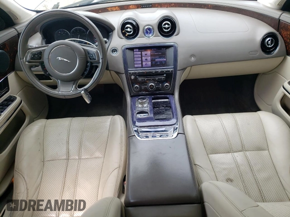 2013 Jaguar XJ with VIN SAJWA1C77D8V41738, listed as a Copart auction lot 53796225 with 104,063 mi miles and Salvage Title. Bid and sale history available at DreamBid. Image 8.