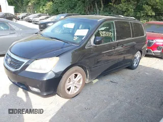 2010 Honda Odyssey Touring with VIN 5FNRL3H96AB031016, listed as a IAAI auction lot 42828397 with 261,881 mi miles and . Bid and sale history available at DreamBid. Image 2.