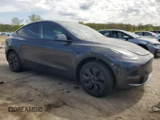 2025 Tesla Model Y Long Range with VIN 7SAYGDED7SF320702, listed as a Copart auction lot 54655325 with 1,169 mi miles and Salvage Title. Bid and sale history available at DreamBid. Image 4.