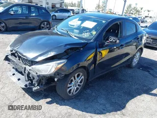 2016 Scion iA z VIN 3MYDLBZV0GY123351, wystawiony jako IAAI lot #41736327 z przebiegiem 86 804 mil mil oraz . Historia ofert i sprzedaży dostępna na DreamBid. Obrazek 2.