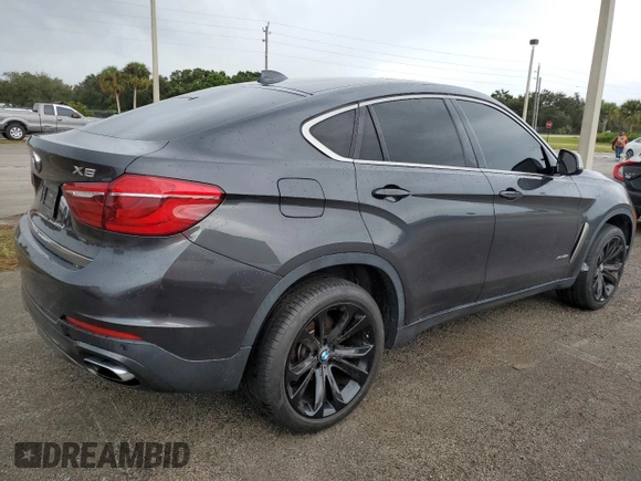 2018 BMW X6 xDrive50i with VIN 5UXKU6C5XJ0W39056, listed as a Copart auction lot 75116634 with 90,043 mi miles and Salvage Title. Bid and sale history available at carsss.com. Image 3.