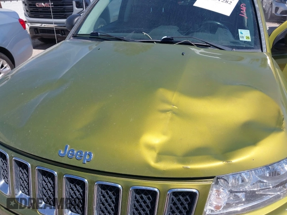 2012 Jeep Compass Latitude with VIN 1C4NJCEB9CD688401, listed as a IAAI auction lot 41801282 with 154,059 mi miles and . Bid and sale history available at carsss.com. Image 10.