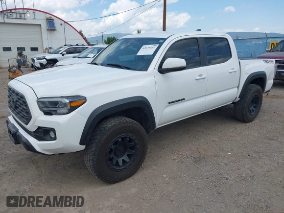 2022 Toyota Tacoma SR with VIN 3TMCZ5AN1NM478457, listed as a IAAI auction lot 42479107 with 59,547 mi miles and . Bid and sale history available at DreamBid. Image 2.