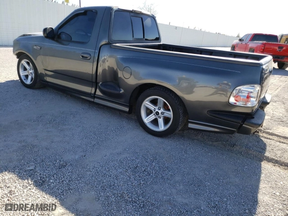 2003 Ford F-150 Lightning with VIN 2FTRF07313CA43362, listed as a Copart auction lot 87544765 with 98,589 mi miles and Salvage Title. Bid and sale history available at carsss.com. Image 2.