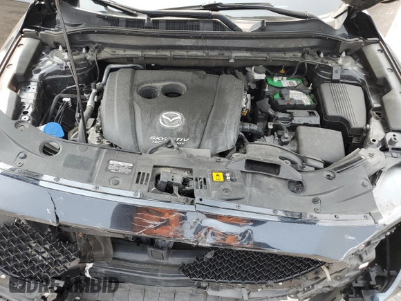 2019 Mazda CX-5 Grand Touring with VIN JM3KFBDM2K0569829, listed as a Copart auction lot 59060965 with 99,359 mi miles and Salvage title. Bid and sale history available at DreamBid. Image 12.