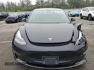 2023 Tesla Model 3 with VIN 5YJ3E1EA9PF687187, listed as a Copart auction lot 61044055 with 7,007 mi miles and Salvage title. Bid and sale history available at DreamBid. Image 5.