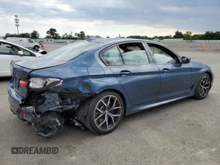 2023 BMW 5 Series M550i xDrive with VIN WBA13BK06PCM31937, listed as a Copart auction lot 66490494 with 24,972 mi miles and Salvage title. Bid and sale history available at DreamBid. Image 3.