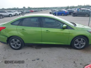 2018 Ford Focus SE z VIN 1FADP3FE5JL222542, wystawiony jako IAAI lot #42265608 z przebiegiem 107 397 mil mil oraz . Historia ofert i sprzedaży dostępna na DreamBid. Obrazek 13.