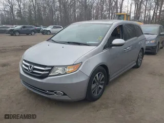 2016 Honda Odyssey Touring Elite with VIN 5FNRL5H96GB062318, listed as a IAAI auction lot 41660493 with 137,269 mi miles. Bid and sale history available at carsss.com. Image 2.