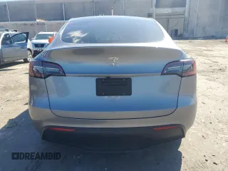 2025 Tesla Model Y Long Range with VIN 7SAYGDED0SF247561, listed as a Copart auction lot 50736875 with 9,094 mi miles and Salvage Title. Bid and sale history available at DreamBid. Image 6.