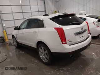 2012 Cadillac SRX Premium Collection z VIN 3GYFNFE38CS591123, wystawiony jako IAAI lot #41827636 z przebiegiem 143 867 mil mil oraz . Historia ofert i sprzedaży dostępna na DreamBid. Obrazek 3.