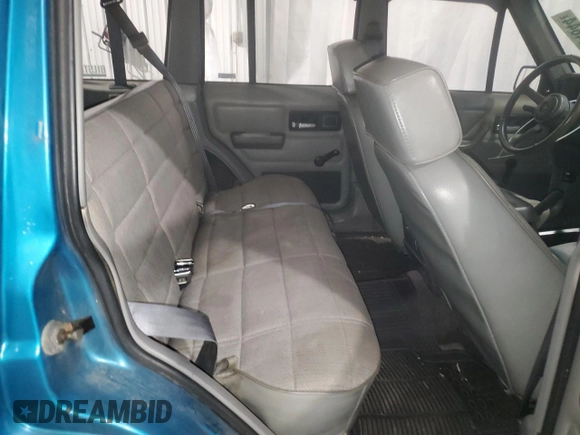 1994 Jeep Cherokee Sport with VIN 1J4FJ68S5RL109124, listed as a Copart auction lot 85524644 with 369,388 mi miles and Salvage title. Bid and sale history available at DreamBid. Image 11.