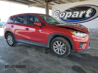 2016 Mazda CX-5 Sport with VIN JM3KE2BY8G0837203, listed as a Copart auction lot 54960845 with 116,656 mi miles and Salvage title. Bid and sale history available at DreamBid. Image 4.