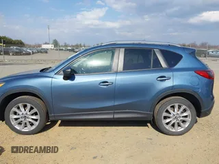 2015 Mazda CX-5 Grand Touring with VIN JM3KE4DY5F0469098, listed as a IAAI auction lot 41858792 with 174,883 mi miles. Bid and sale history available at carsss.com. Image 15.