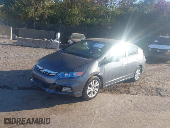 2012 Honda Insight EX z VIN JHMZE2H70CS004787, wystawiony jako IAAI lot #40668475 z przebiegiem 127 599 mil mil oraz . Historia ofert i sprzedaży dostępna na DreamBid. Obrazek 2.