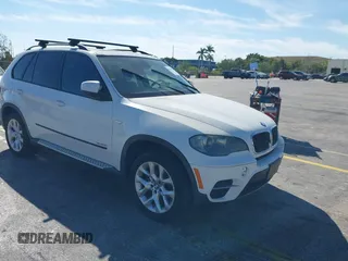 2011 BMW X5 35i with VIN 5UXZV4C5XBL740100, listed as a IAAI auction lot 41863141 with 179,190 mi miles. Bid and sale history available at carsss.com. Image 1.
