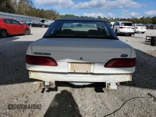 1992 Ford Taurus GL z VIN 1FALP52U5NA280821, wystawiony jako Copart lot #77457304 z przebiegiem 33 484 mil mil oraz Szkoda całkowita • Salvage title. Historia ofert i sprzedaży dostępna na DreamBid. Obrazek 6.