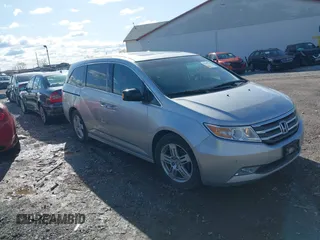 2011 Honda Odyssey Touring with VIN 5FNRL5H92BB049901, listed as a IAAI auction lot 41985224 with 101,957 mi miles and . Bid and sale history available at DreamBid. Image 1.